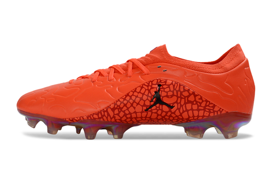 Tacos de Fútbol Jordan x Nike Phantom GX Elite FG - Naranja y Negro (Césped Natural / Firm Ground)